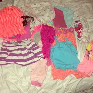 11 shirts, 3 shirts, 3 tanks, 3 wash cloths